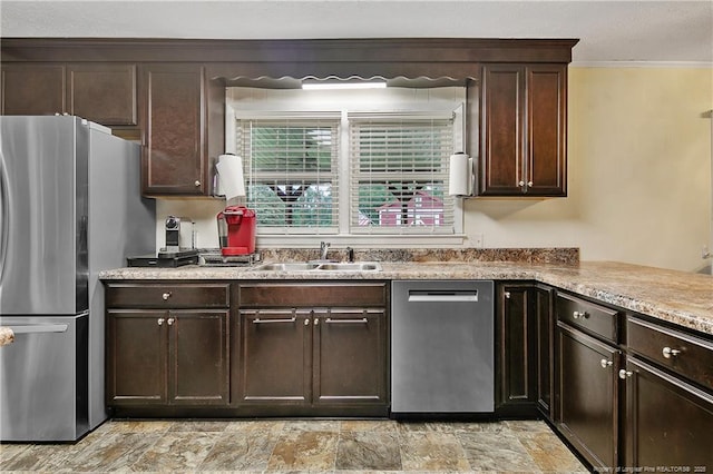 2547 Red Springs Rd, Raeford, NC 28376 - kitchen with appliances with stainless steel finishes, a sink, dark brown cabinetry, crown molding, and light countertops