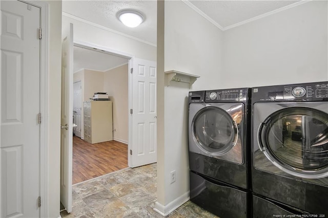 2547 Red Springs Rd, Raeford, NC 28376 - washroom featuring washer and dryer, stone finish floors, ornamental molding, and baseboards