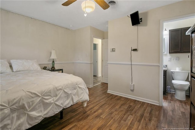 2547 Red Springs Rd, Raeford, NC 28376 - bedroom featuring dark wood-type flooring, baseboards, ensuite bath, and a ceiling fan