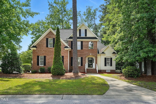 3020 Woods Walk Way, Rocky Mount, NC 27804 - view of front of house featuring a front lawn and brick siding