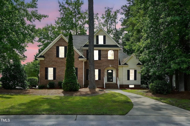 3020 Woods Walk Way, Rocky Mount, NC 27804 - view of front facade featuring a yard and brick siding
