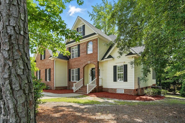 3020 Woods Walk Way, Rocky Mount, NC 27804 - view of front of home with brick siding and a shingled roof