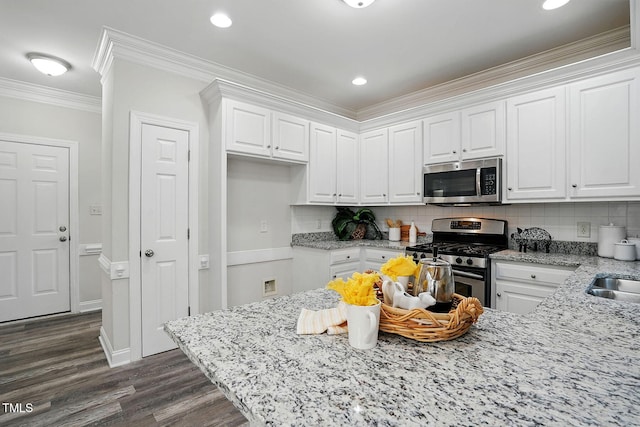 3020 Woods Walk Way, Rocky Mount, NC 27804 - kitchen featuring appliances with stainless steel finishes, white cabinets, dark wood finished floors, light stone counters, and tasteful backsplash