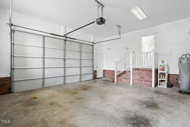 3020 Woods Walk Way, Rocky Mount, NC 27804 - garage with water heater and a garage door opener