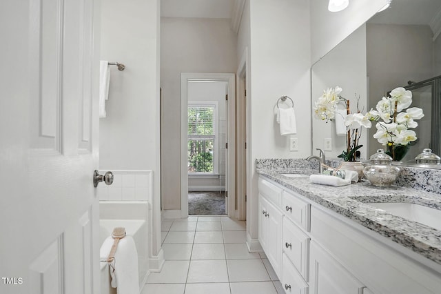 3020 Woods Walk Way, Rocky Mount, NC 27804 - full bath with double vanity, tile patterned flooring, a bathtub, and baseboards
