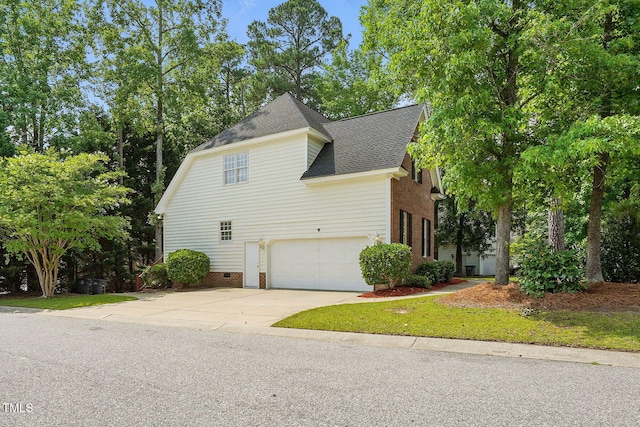 3020 Woods Walk Way, Rocky Mount, NC 27804 - view of home's exterior with roof with shingles, a garage, and driveway