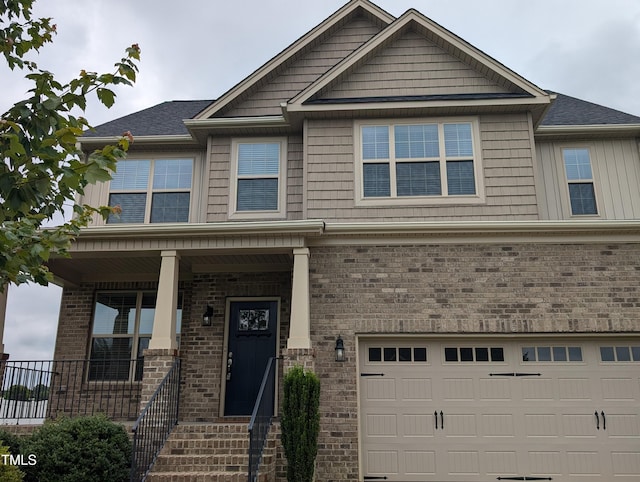 319 Brinkley Cir, Mebane, NC 27302 - craftsman-style home featuring an attached garage, brick siding, and a porch
