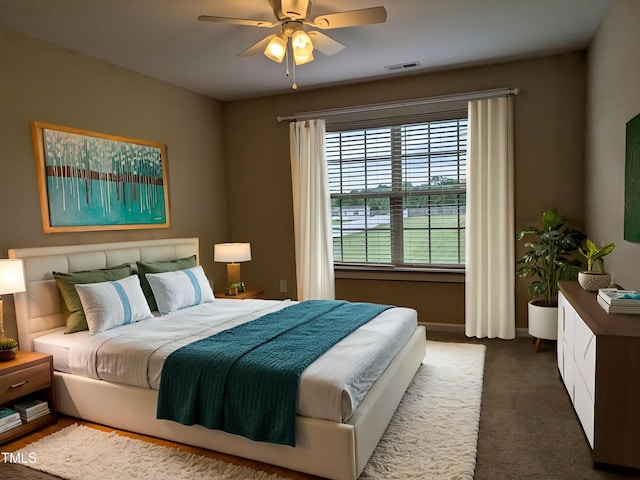 319 Brinkley Cir, Mebane, NC 27302 - bedroom featuring dark carpet, a ceiling fan, and baseboards