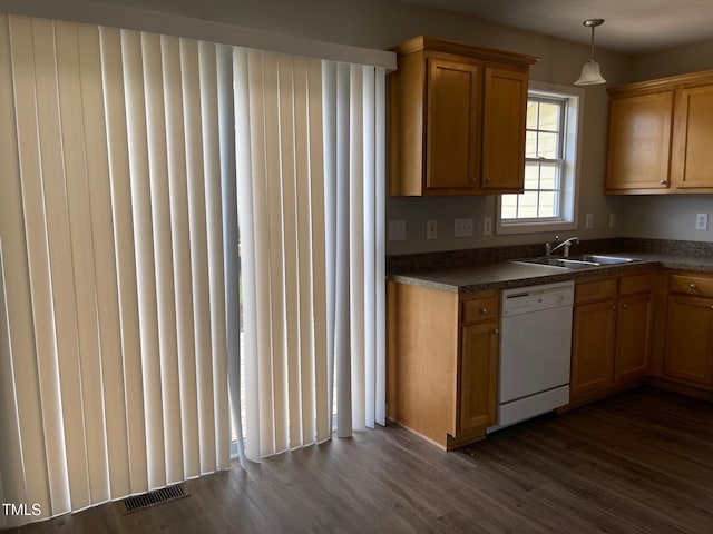 78 Ariel St, Lillington, NC 27546 - kitchen featuring white dishwasher, a sink, dark countertops, dark wood-style flooring, and hanging light fixtures