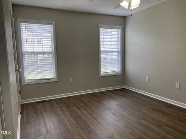 78 Ariel St, Lillington, NC 27546 - empty room with dark wood-type flooring, ceiling fan, baseboards, and a textured ceiling