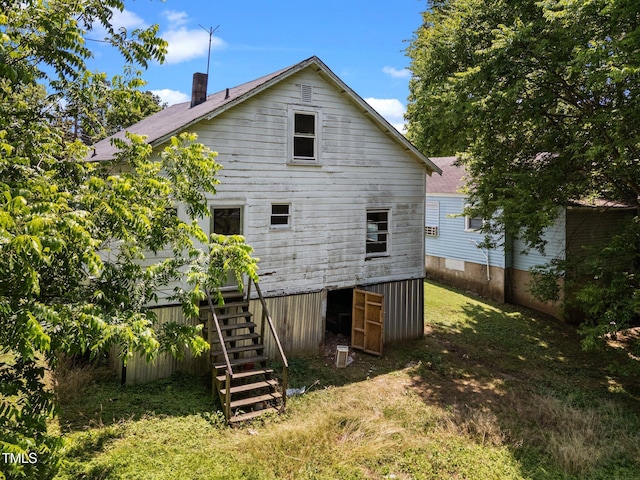 312 W Front St, Oxford, NC 27565 - back of house featuring a lawn, stairway, and a chimney