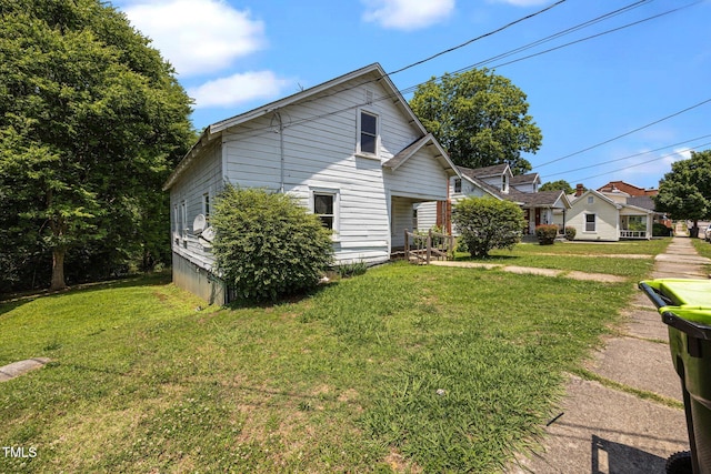 312 W Front St, Oxford, NC 27565 - view of home's exterior featuring a yard
