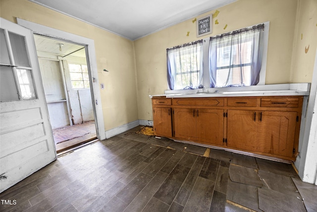 312 W Front St, Oxford, NC 27565 - kitchen featuring dark wood-style floors, brown cabinetry, and light countertops