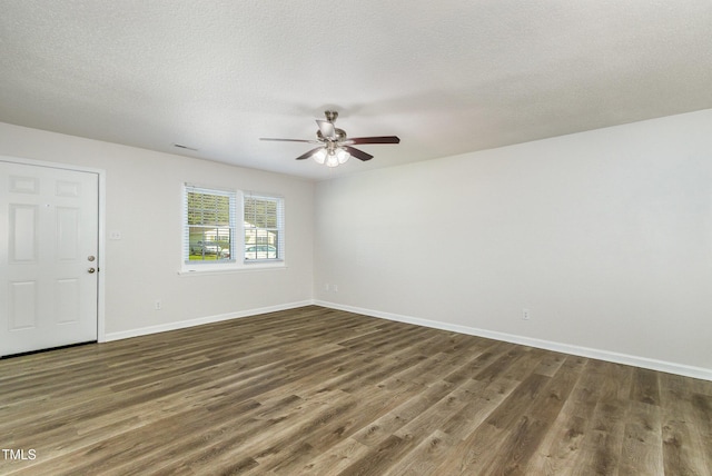 1110 Allgood St, Durham, NC 27704 - spare room with dark wood-style flooring, a ceiling fan, baseboards, and a textured ceiling