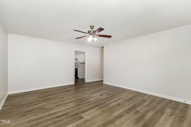 1110 Allgood St, Durham, NC 27704 - spare room featuring a ceiling fan, wood finished floors, and baseboards
