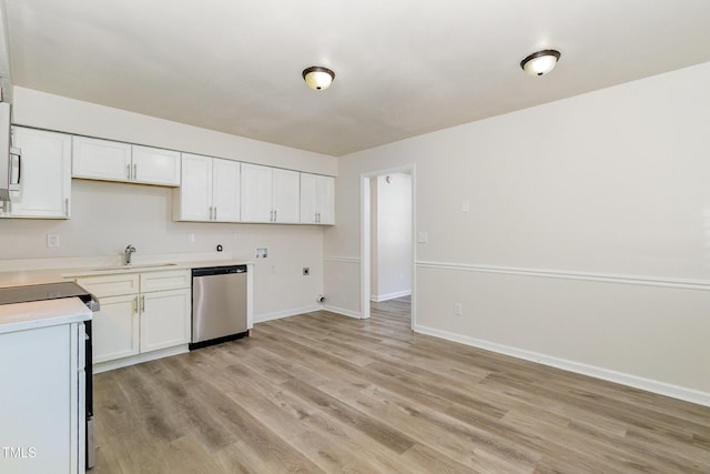 1110 Allgood St, Durham, NC 27704 - kitchen featuring dishwasher, electric stove, a sink, light countertops, and white cabinetry