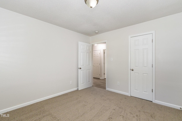 1110 Allgood St, Durham, NC 27704 - unfurnished bedroom with carpet flooring and baseboards