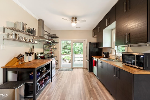 119 Danforth Dr, Cary, NC 27511 - kitchen featuring open shelves, wood counters, appliances with stainless steel finishes, and island range hood