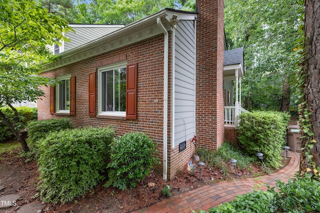 119 Danforth Dr, Cary, NC 27511 - view of home's exterior featuring a chimney and brick siding