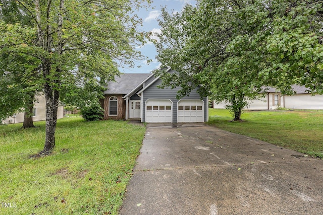 3306 Woodland Park Rd, Durham, NC 27703 - view of front of home featuring a garage, a front yard, driveway, brick siding, and roof with shingles