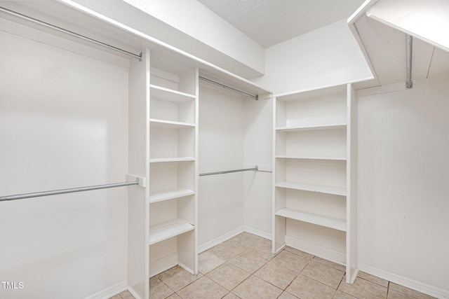 3306 Woodland Park Rd, Durham, NC 27703 - spacious closet featuring light tile patterned floors