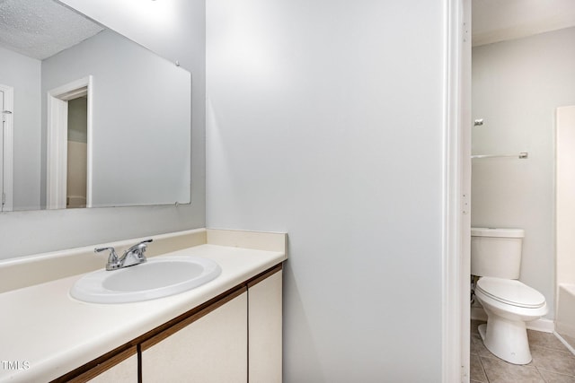 3306 Woodland Park Rd, Durham, NC 27703 - full bath featuring vanity, tile patterned floors, toilet, and a tub