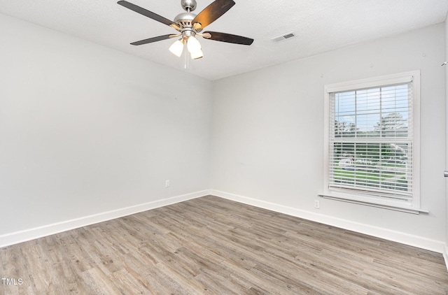 3306 Woodland Park Rd, Durham, NC 27703 - unfurnished room with wood finished floors, baseboards, and a ceiling fan