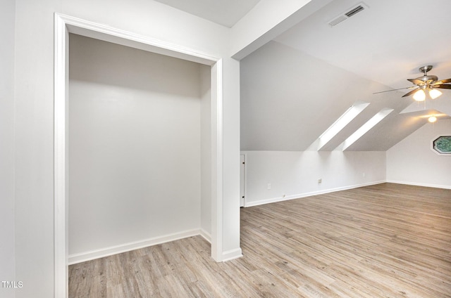3306 Woodland Park Rd, Durham, NC 27703 - additional living space featuring ceiling fan, wood finished floors, a skylight, vaulted ceiling, and baseboards