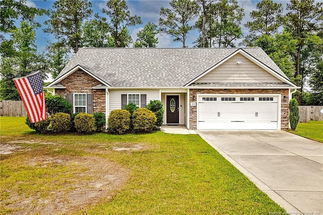 3453 Thrower Rd, Hope Mills, NC 28348 - view of front of property featuring stone siding, an attached garage, concrete driveway, and roof with shingles