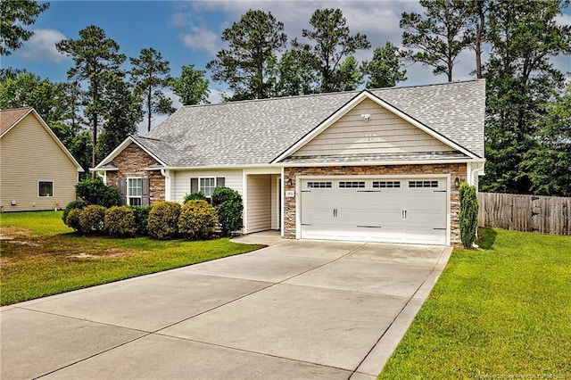 3453 Thrower Rd, Hope Mills, NC 28348 - view of front of home with an attached garage, concrete driveway, roof with shingles, and stone siding