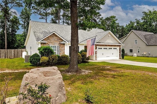 3453 Thrower Rd, Hope Mills, NC 28348 - view of front of house featuring concrete driveway, a garage, stone siding, roof with shingles, and central AC
