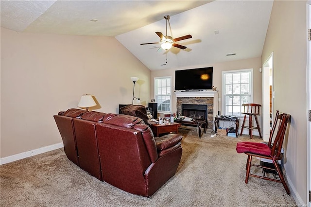 3453 Thrower Rd, Hope Mills, NC 28348 - living area with carpet floors, lofted ceiling, a stone fireplace, a ceiling fan, and healthy amount of natural light