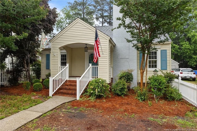 123 Ellington St, Fayetteville, NC 28305 - view of front of house with covered porch and a chimney
