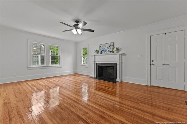 123 Ellington St, Fayetteville, NC 28305 - unfurnished living room featuring ceiling fan, wood finished floors, baseboards, and ornamental molding