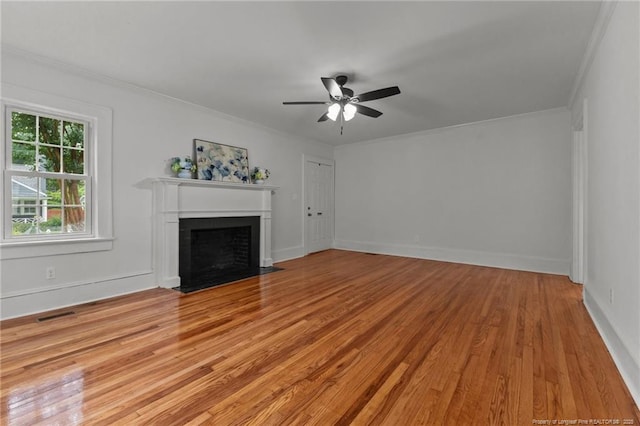 123 Ellington St, Fayetteville, NC 28305 - unfurnished living room featuring a ceiling fan, a fireplace with flush hearth, light wood-style flooring, crown molding, and baseboards