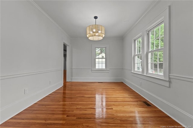 123 Ellington St, Fayetteville, NC 28305 - empty room with wood finished floors, a chandelier, ornamental molding, and baseboards