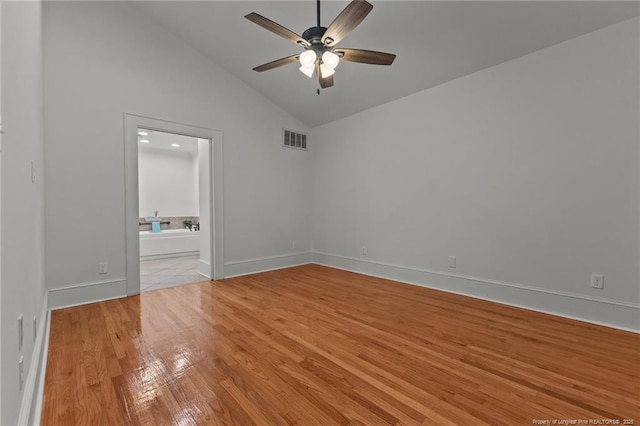123 Ellington St, Fayetteville, NC 28305 - spare room with a ceiling fan, light wood-style floors, high vaulted ceiling, and baseboards