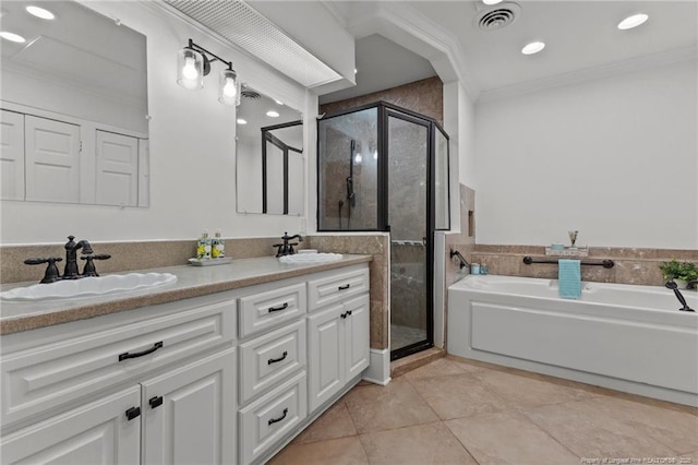 123 Ellington St, Fayetteville, NC 28305 - bathroom featuring tile patterned floors, a shower stall, ornamental molding, a garden tub, and double vanity