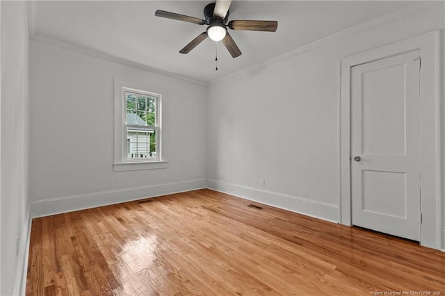 123 Ellington St, Fayetteville, NC 28305 - unfurnished room featuring light wood-style floors, baseboards, crown molding, and a ceiling fan