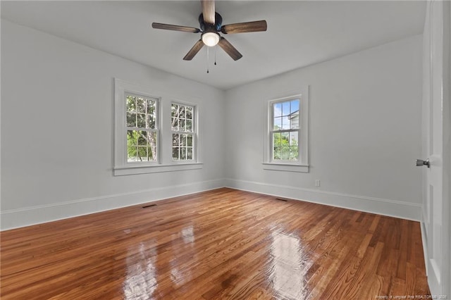 123 Ellington St, Fayetteville, NC 28305 - unfurnished room with wood finished floors, baseboards, and ceiling fan