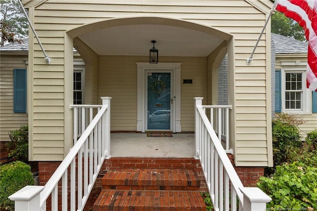123 Ellington St, Fayetteville, NC 28305 - doorway to property with a porch and roof with shingles