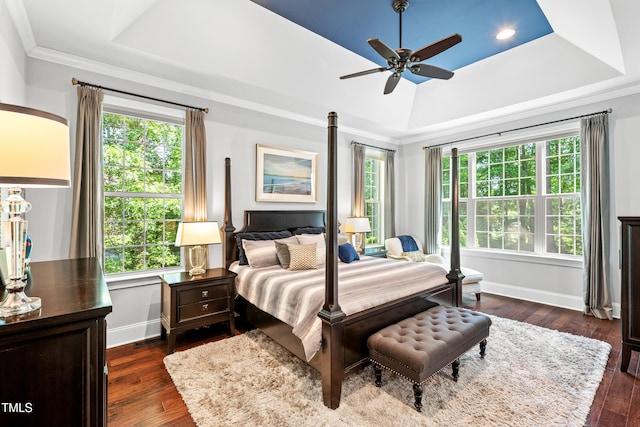 7552 Hasentree Club Dr, Wake Forest, NC 27587 - bedroom featuring a tray ceiling, ornamental molding, dark wood finished floors, baseboards, and ceiling fan