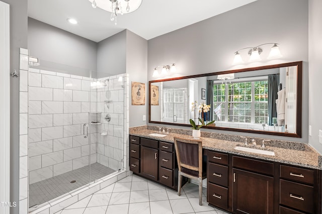 7552 Hasentree Club Dr, Wake Forest, NC 27587 - bathroom featuring a stall shower, double vanity, and marble look tiles