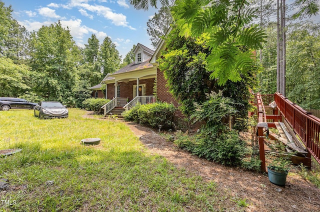 3304 Black Stallion Ct, Zebulon, NC 27597 - view of green lawn featuring a porch