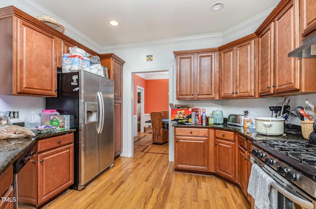 3304 Black Stallion Ct, Zebulon, NC 27597 - kitchen with appliances with stainless steel finishes, light wood-type flooring, ornamental molding, brown cabinets, and recessed lighting
