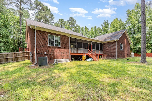 3304 Black Stallion Ct, Zebulon, NC 27597 - back of house featuring a sunroom, brick siding, and stairway