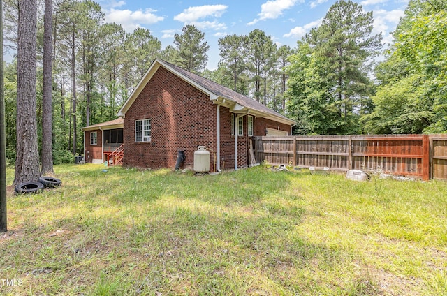 3304 Black Stallion Ct, Zebulon, NC 27597 - view of home's exterior featuring brick siding and an attached garage