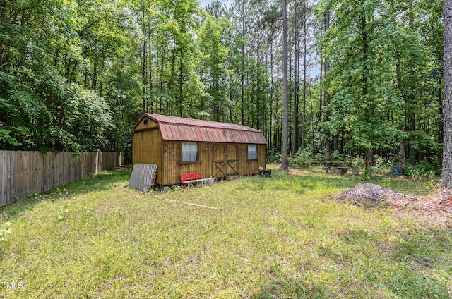 3304 Black Stallion Ct, Zebulon, NC 27597 - view of yard featuring a storage unit and a forest view