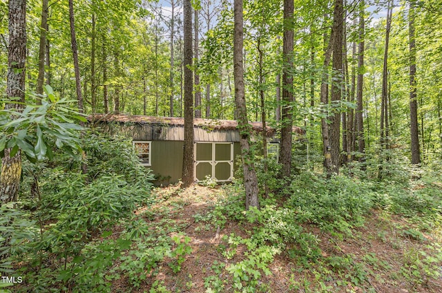 3304 Black Stallion Ct, Zebulon, NC 27597 - view of shed featuring a wooded view