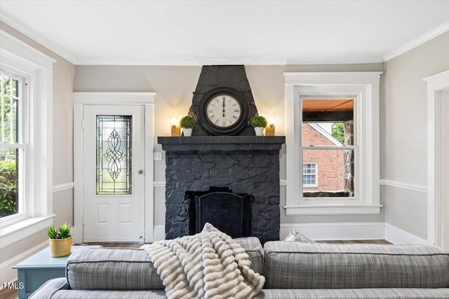 205 Forest Hill Ave, Rocky Mount, NC 27804 - living room featuring ornamental molding, a stone fireplace, and baseboards